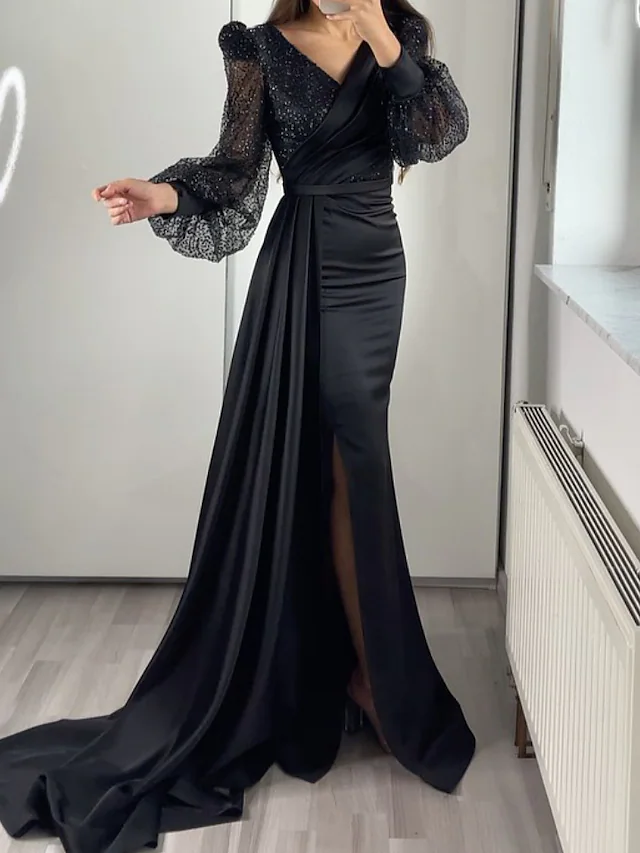 فساتين سواريه سوداء 2023 أجمل فساتين سهرة سوداء فستان بأكمام طويلة وواسعة موضة 2023